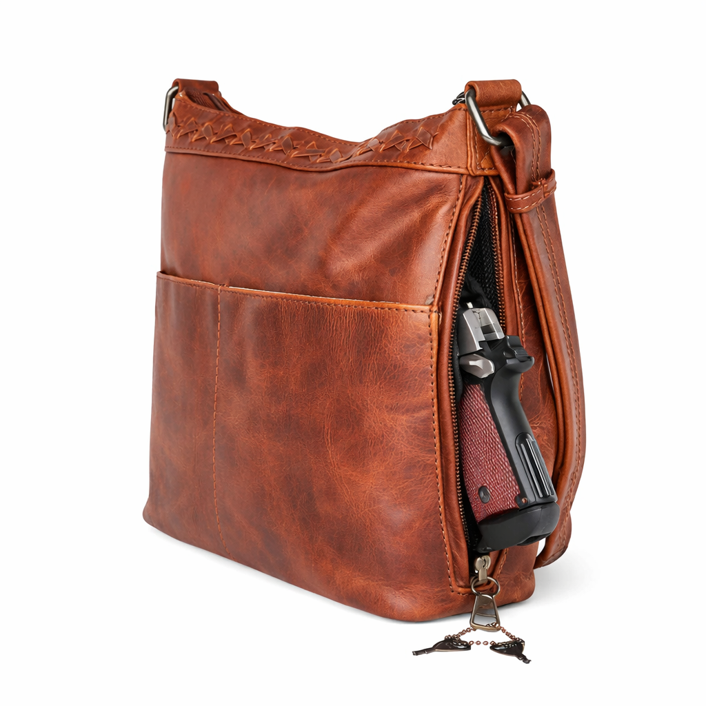 Concealment pocket zipper open on the Concealed Carry Faith Leather Crossbody by Lady Conceal in Cognac