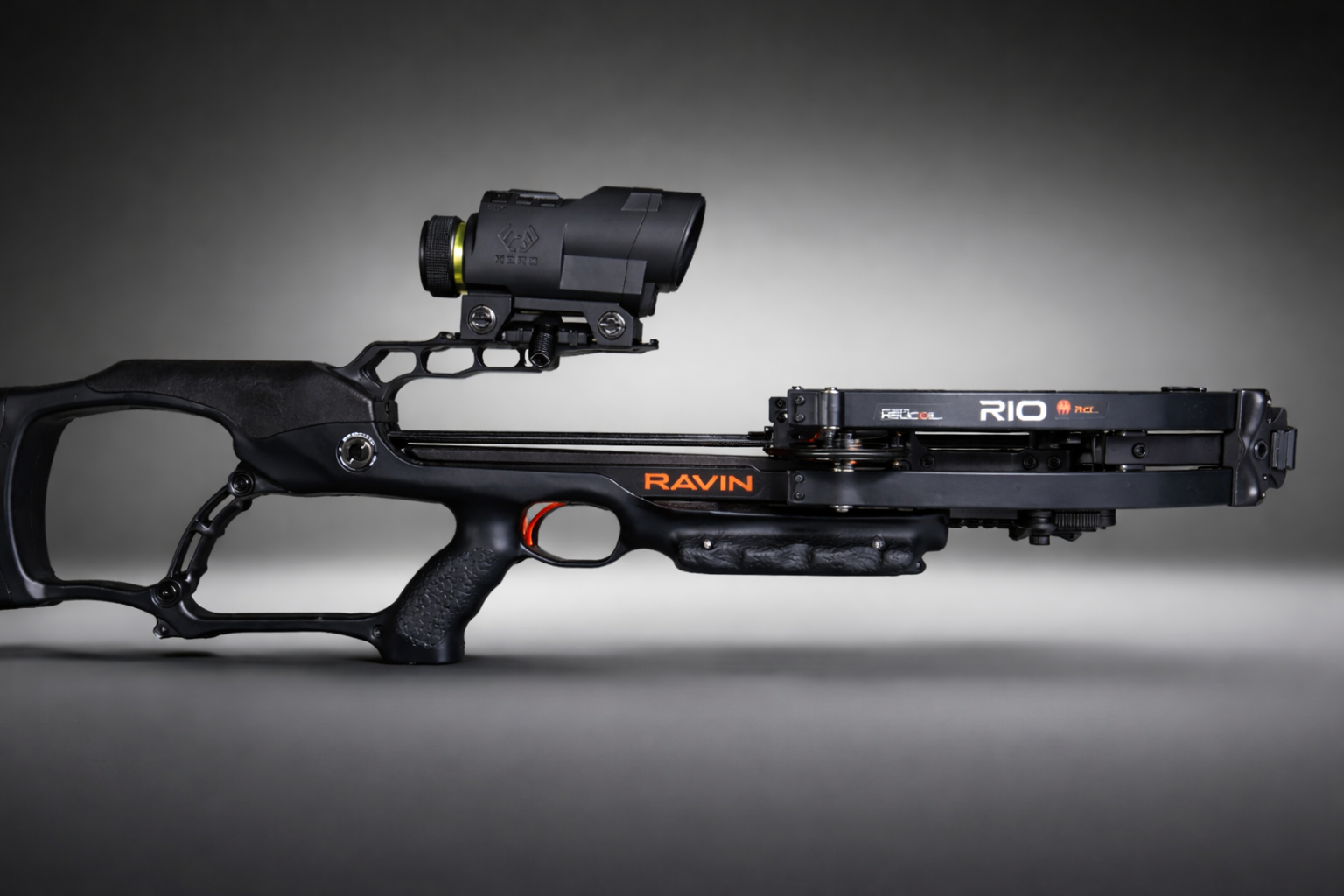 Ravin crossbow with Ravin Integrated Xero X1i scope mounted, studio lighting, gray background